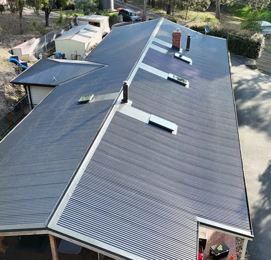 Aerial view of a completed metal roof replacement in Melbourne